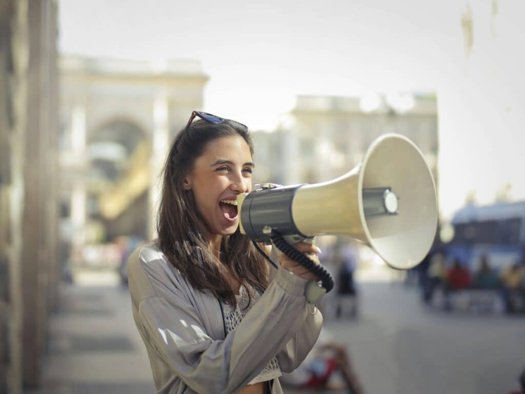 woman talking into a megaphone